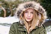 Teenage Girl Wearing Hooded Parka Outdoors