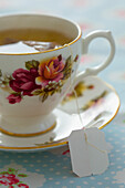 Floral Pattern Tea Cup with Green Tea