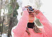 Teenage Girl Taking a Photograph