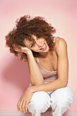 Smiling Young Woman Crouching