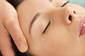 Woman Receiving a Facial Massage, Close-up View