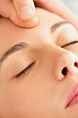 Woman Receiving a Facial Massage, Close-up View