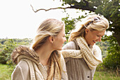 Mother and Daughter Walking in Countryside