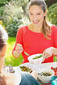 Woman Having Lunch in Garden with Friend