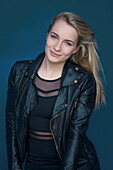 Young Woman in Black Leather Jacket Smiling