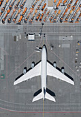 View from above airplane parked on airport tarmac