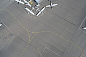 View from above propellor airplanes and lines on airport tarmac