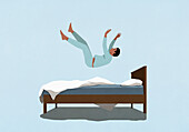 Man in pajamas falling on bed