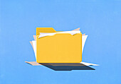 Paperwork spilling out of folder on blue background