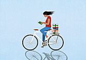 Woman reading book on bicycle against blue background