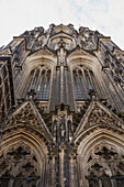 Low angle view dramatic Cologne Cathedral facade, Cologne, Germany