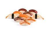 Variety of nigiri pieces arranged on a plain white background