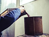 Traditional preparation of the dark palo liqueur from Mallorca