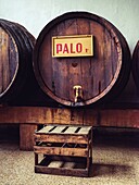Traditional Mallorcan palo liqueur in old wooden barrels