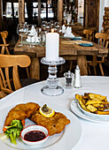 Rustic mountain restaurant with traditional schnitzel meal