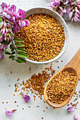 Healthy bee pollen grains. Bee pollen on a bowl and acacia flow