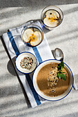 Top view of mushroom cream soup and apple water dinner set