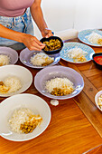 Anonymous woman preparing vegan dishes in a cookery class