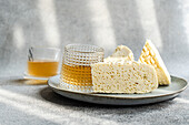 Traditional Georgian sulguni cheese and amber-coloured wine on a plate
