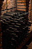 Traditional wine cellar in Kakheti with old, dusty bottles
