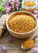 Healthy bee pollen grains. Bee pollen on a bowl and acacia flow