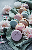 Beautiful colourful delicious macaroons on a concrete background