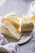 Georgian sulguni cheese with amber-coloured wine on a white plate