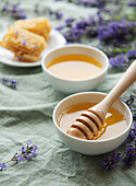 Jar of honey and fresh lavender flowers