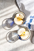 Top view of apple water with fresh slices in clear glass