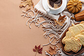 Cup of coffee, cookies on tray, yellow leaves.