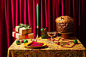 Festively laid Christmas table with presents and panettone