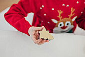 A child bakes with a festive theme for Christmas