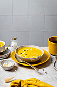 Creamy pumpkin soup with rustic autumn styling