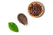 Homemade coffee scrub and beans isolated on a white background