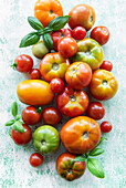Colourful mixture of ripe tomatoes on a textured surface with