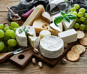 Assorted cheeses, grapes and wine