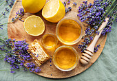 Jar with honey and fresh lavender flowers