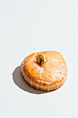 Banana-filled donut with glaze and banana chip topping