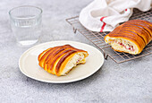Sliced brioche with cherry and cottage cheese on the kitchen counter