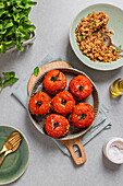 Stuffed tomatoes and brown rice ingredients ready for cooking