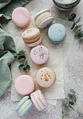 Beautiful colourful delicious macaroons on a concrete background