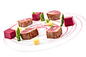 Red tuna steaks with asparagus and beet sauce on white background