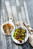 Hearty aubergine and pepper salad with crusty bread