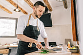 Private chef preparing a meal in the kitchen at home