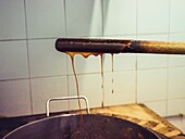 Traditional production of palo liqueur in Mallorca