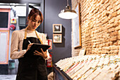Employee manages chocolate selection