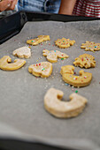 Family baking biscuits together, taken during the baking process
