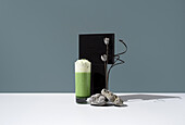 Refreshing matcha tea with whipped cream on a table