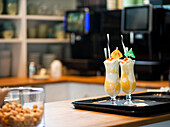 Two gourmet ice cream floats served at a modern cafe