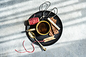 Top view of a morning coffee bar with treats and handicrafts